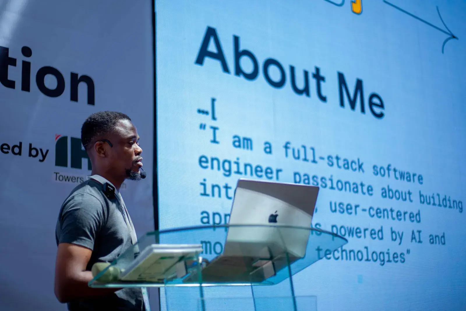 A speaker presenting beside the About screen